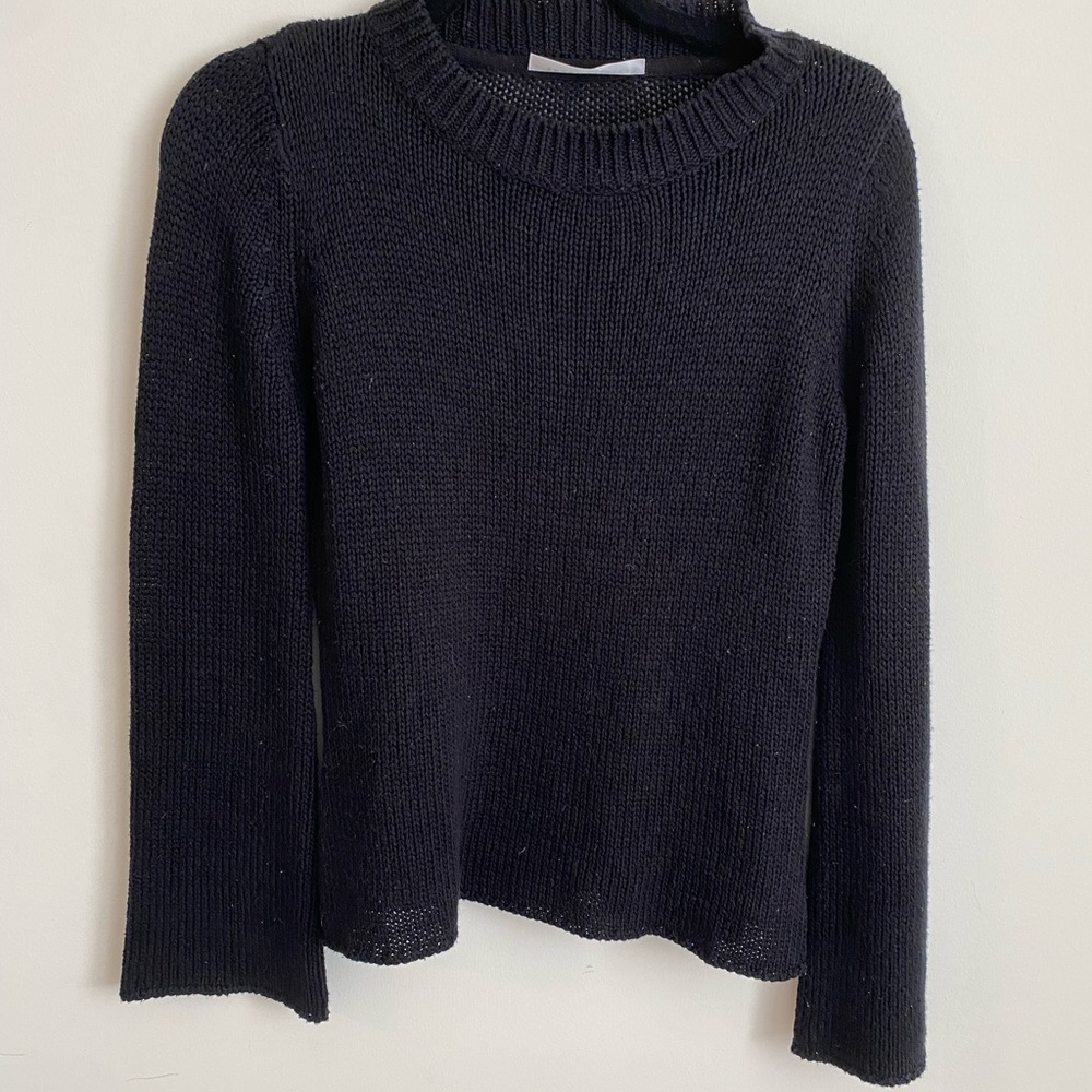 Black sweater with flared sleeves